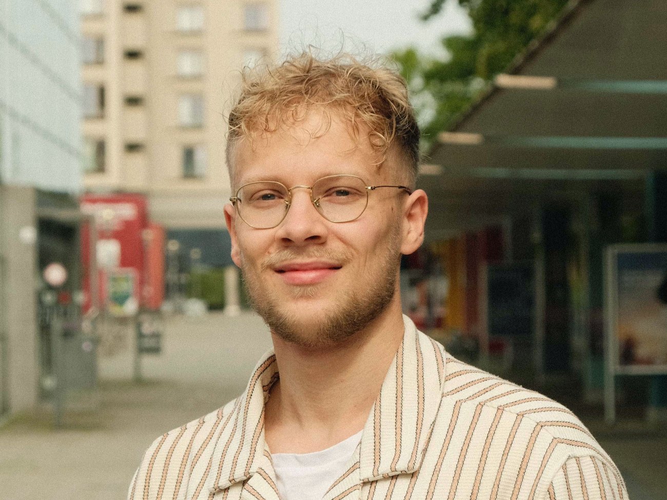 A man is smiling at the camera.