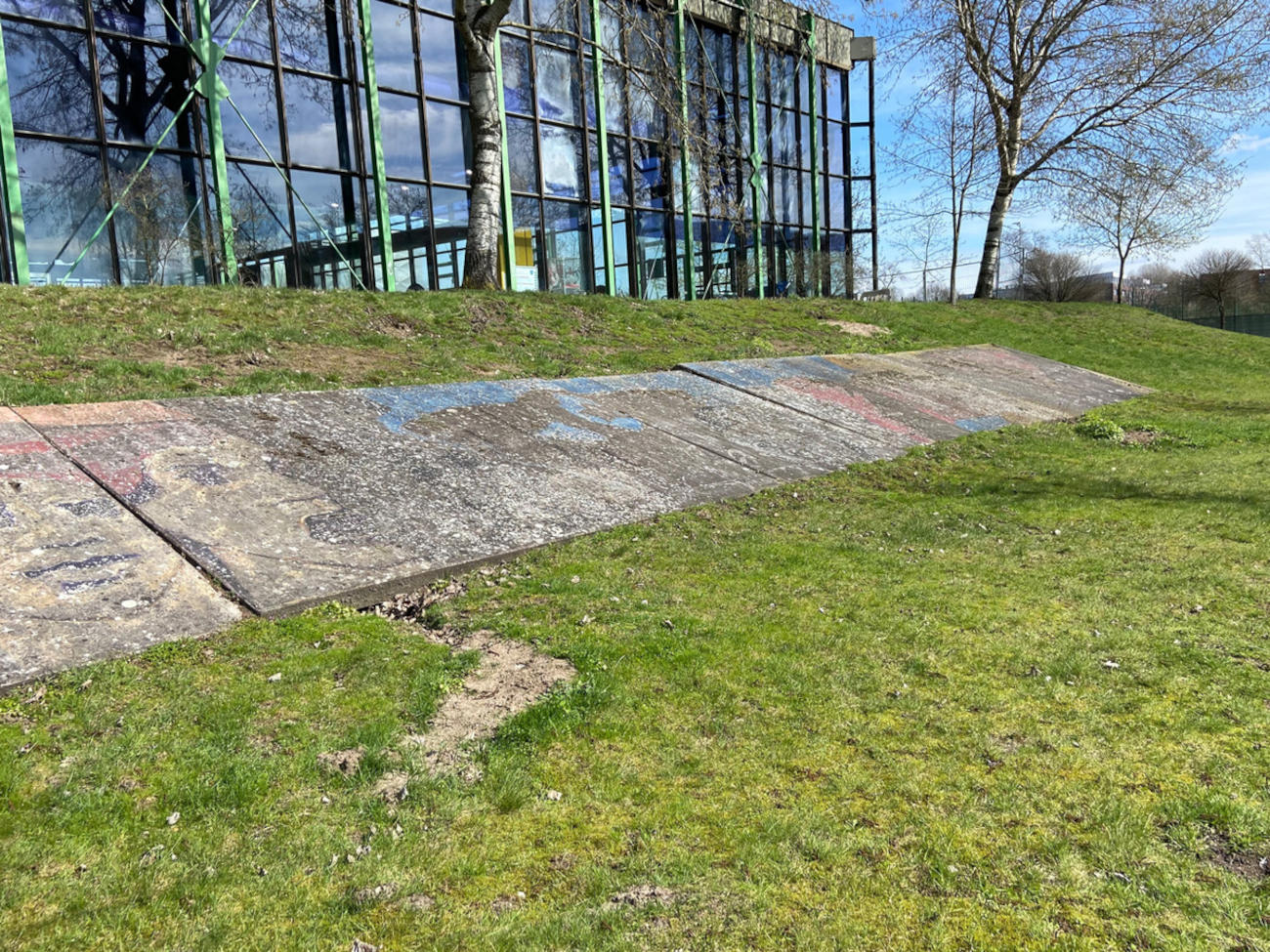 The painted concrete slabs lie between the University Pool and the SFG Building