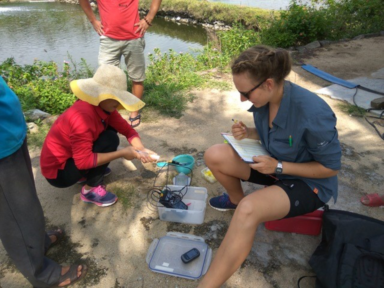 Esther Thomsen taking a water sample