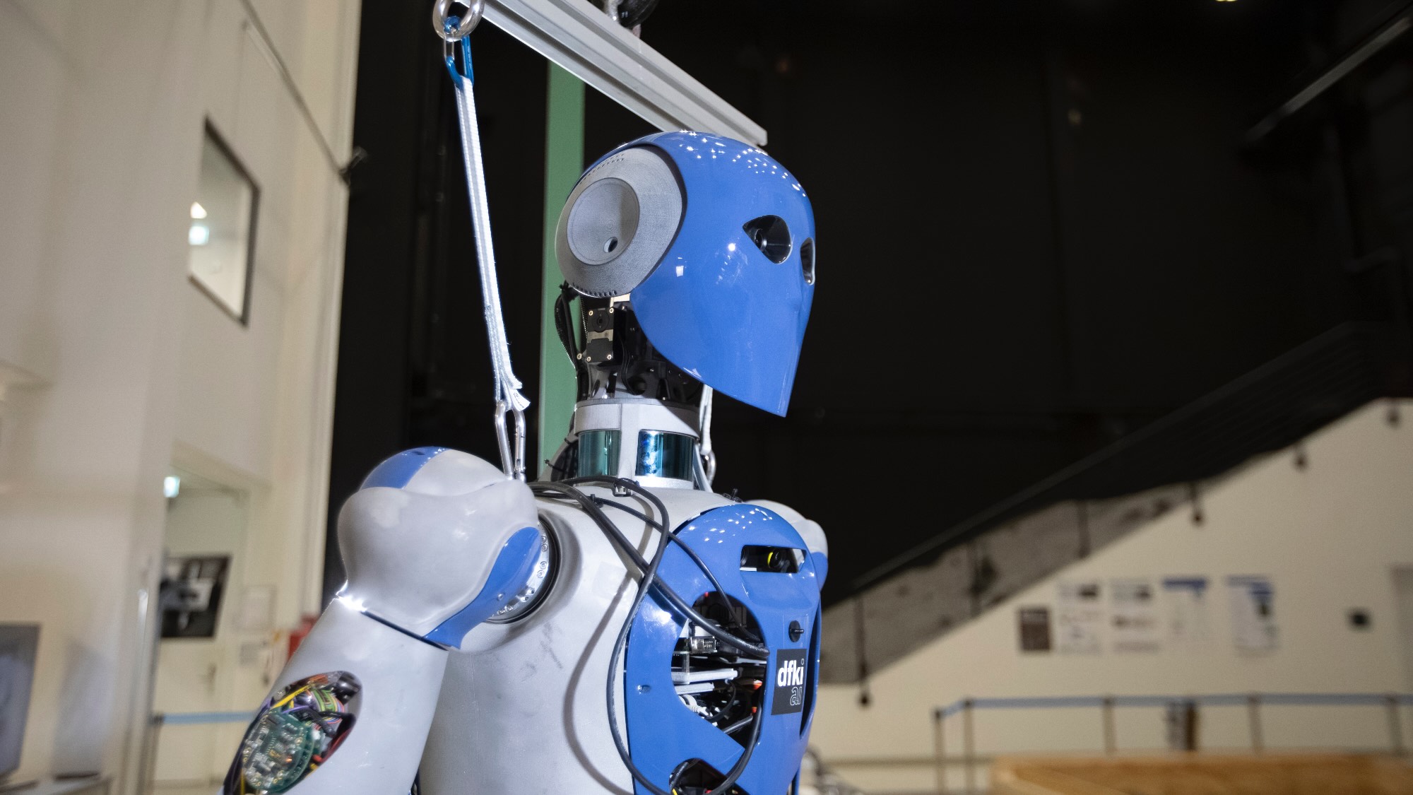 The side profile of a humanoid robot's upper body.