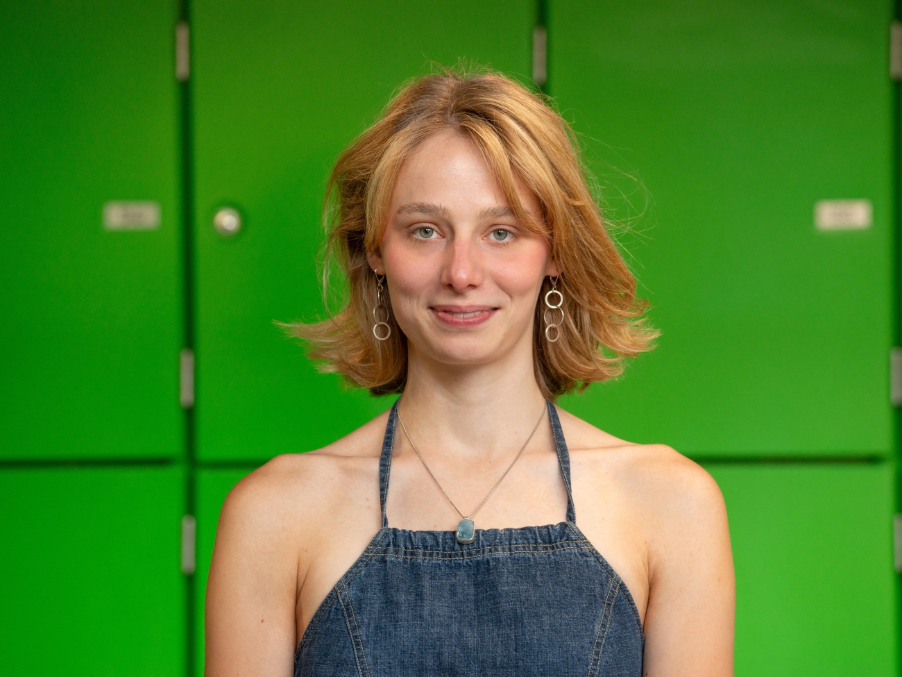 A woman smiles at the camera.