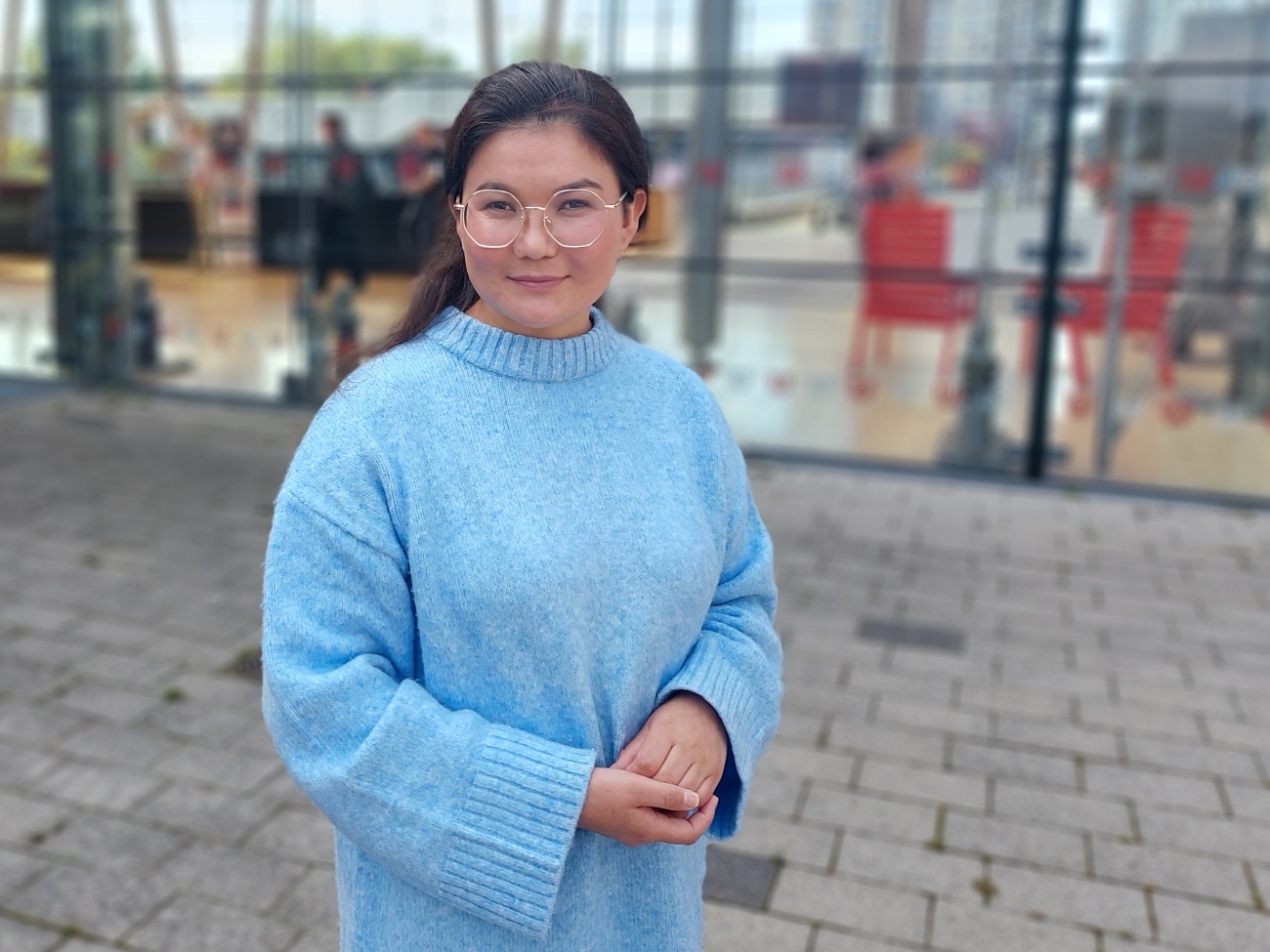 A woman is smiling at the camera.