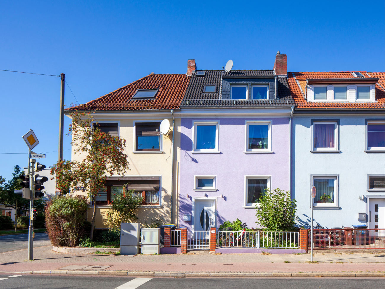 View of a colorful row of houses in a street in Bremen Neustadt.