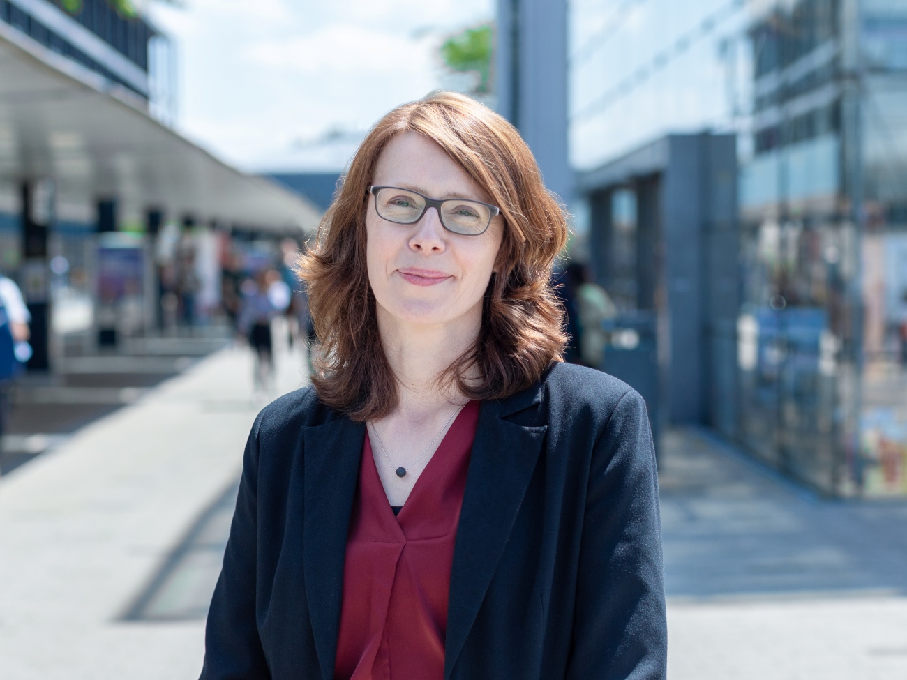 A person is standing on the boulevard.